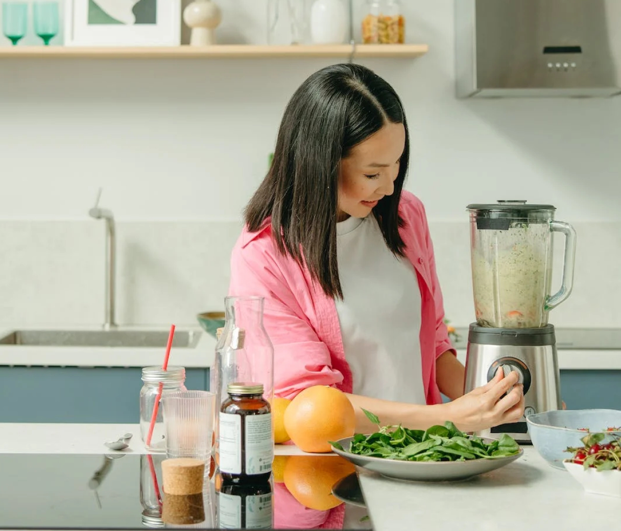 Woman cooking with blender